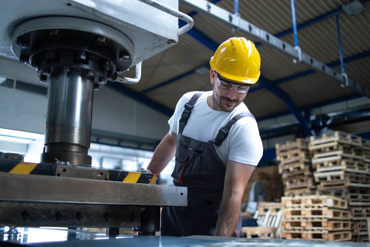 factory-employee-working-industrial-drilling-machine-production-line